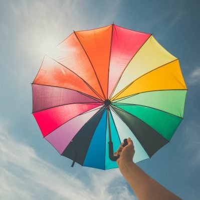 open-colorful-rainbow-umbrella-on-blue-sky-backgro-2025-10-12-23-26-13-utc-scaled.jpg